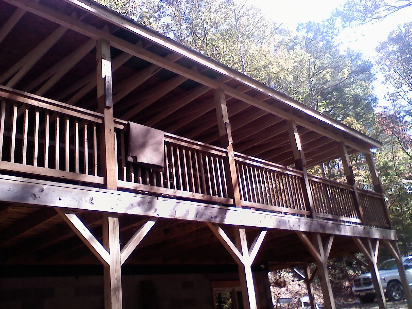 Timber framing under a new elevated porch and deck — Roof Leak Repair in Panora by Roofing Brothers